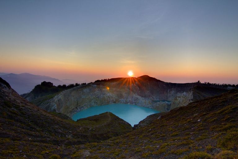 Photo: Michael Day (Kelimutu Sunrise  Uploaded by russavia) [CC BY 2.0 (http://creativecommons.org/licenses/by/2.0)], via Wikimedia Commons